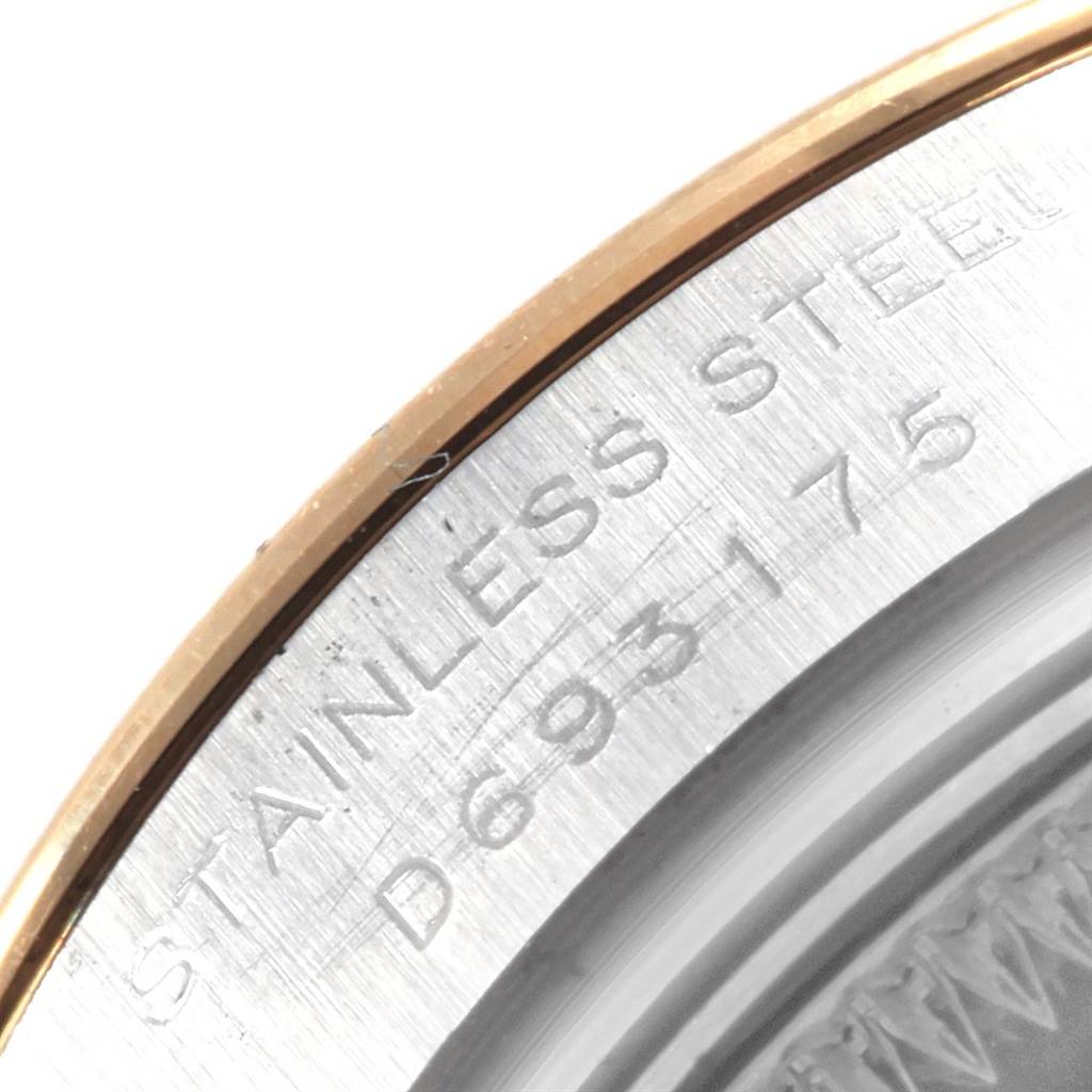 The image shows a close-up of the case back's engraving on a Rolex Datejust 179163 Women's Steel and Gold (two tone) Mother of Pearl Dial 179163 Women's Steel and Gold (two tone) Mother of Pearl Dial watch, highlighting "STAINLESS STEEL" and a partial serial number.