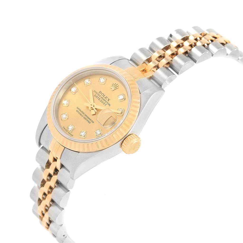This Rolex Datejust 69173 Women's Stainless Steel Champagne Dial 69173 Women's Stainless Steel Champagne Dial watch is shown at an angle showcasing its gold dial, fluted bezel, jubilee bracelet, and crown.