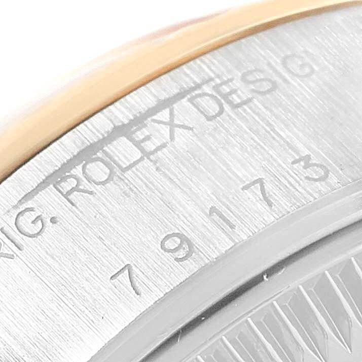 This image captures a close-up of the case back and serial number of a Rolex Datejust 69173 Women's Stainless Steel Champagne Dial 69173 Women's Stainless Steel Champagne Dial watch.