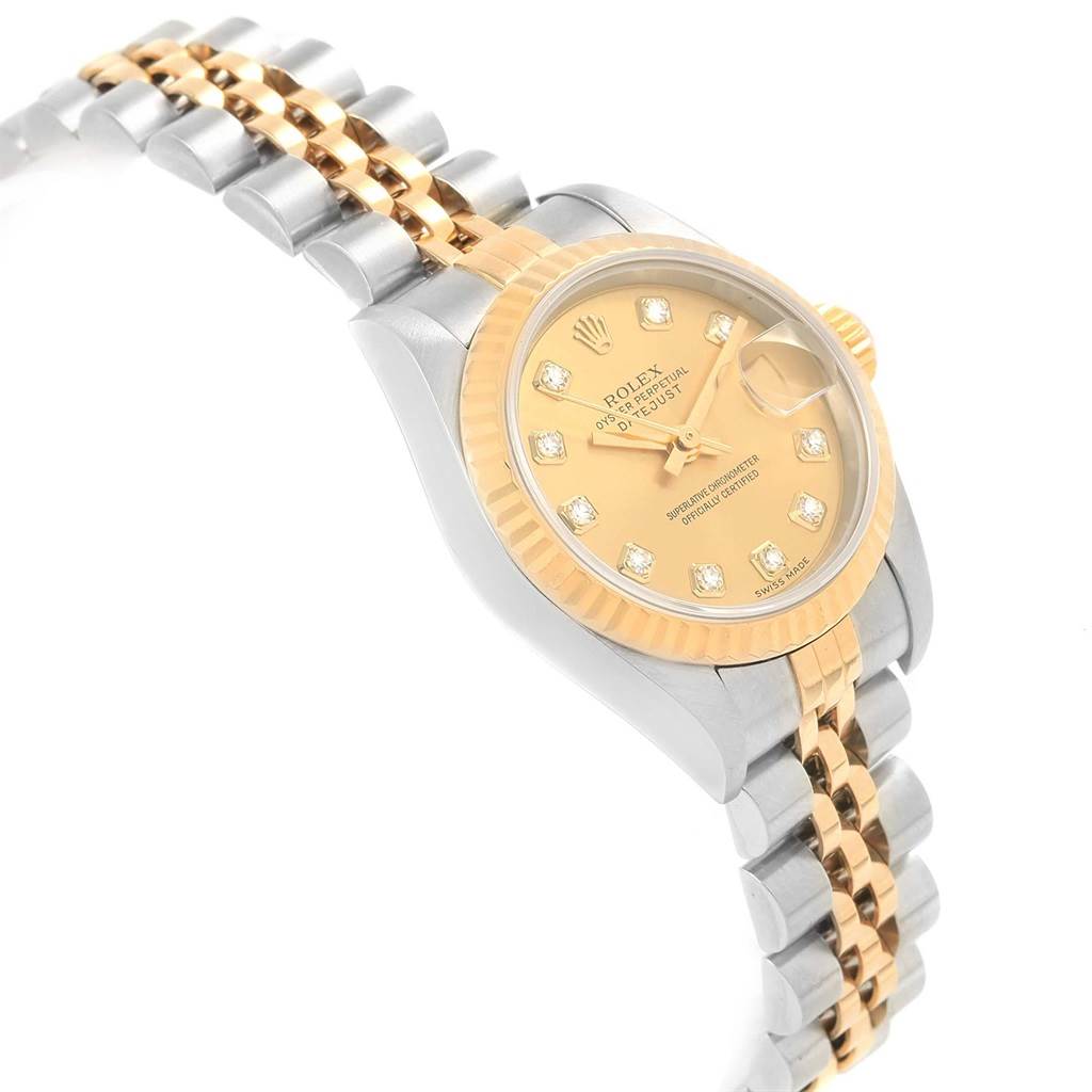 This image shows the Rolex Datejust 69173 Women's Stainless Steel Champagne Dial 69173 Women's Stainless Steel Champagne Dial watch at a tilted angle, highlighting the face, bezel, and two-tone bracelet.