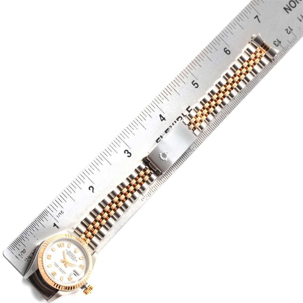 This image shows the face and two-tone bracelet of a Rolex Datejust 79173 Women's Steel and Gold (two tone) White Dial 79173 Women's Steel and Gold (two tone) White Dial watch, aligned with a ruler for measurement.