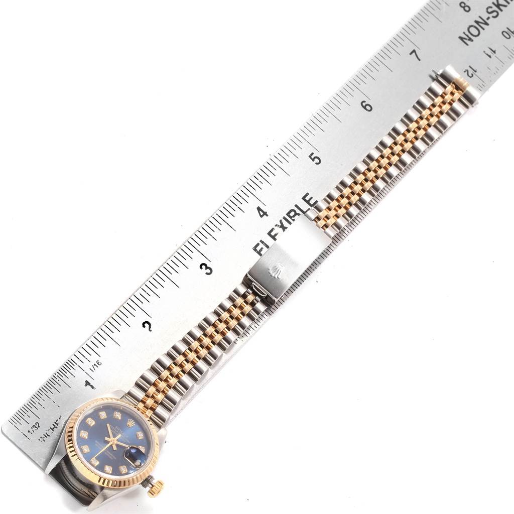 The image shows a Rolex Datejust 69173 Women's Stainless Steel Blue Dial 69173 Women's Stainless Steel Blue Dial watch laid flat alongside a ruler, displaying the bracelet and watch face.