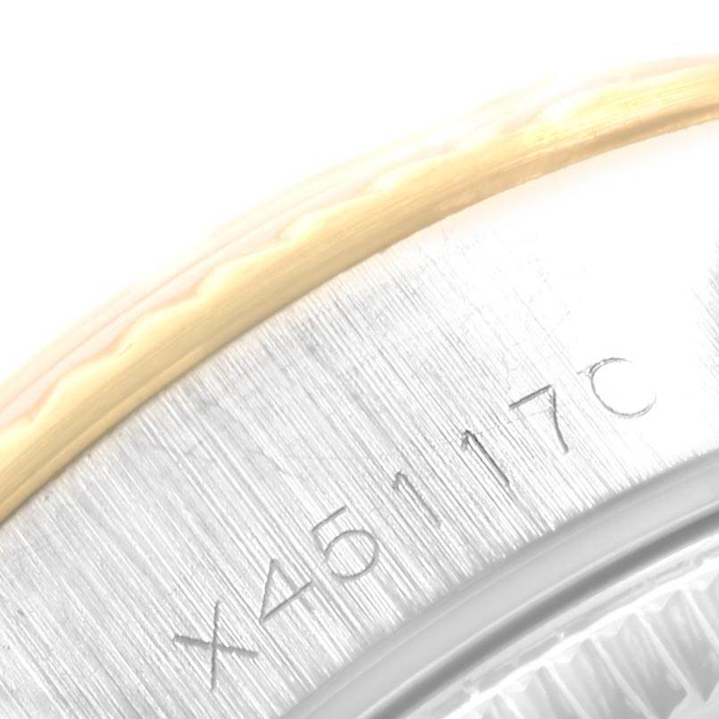 This close-up image shows the serial number engraving on the side of a Rolex Datejust 69173 Women's Stainless Steel Blue Dial 69173 Women's Stainless Steel Blue Dial watch.