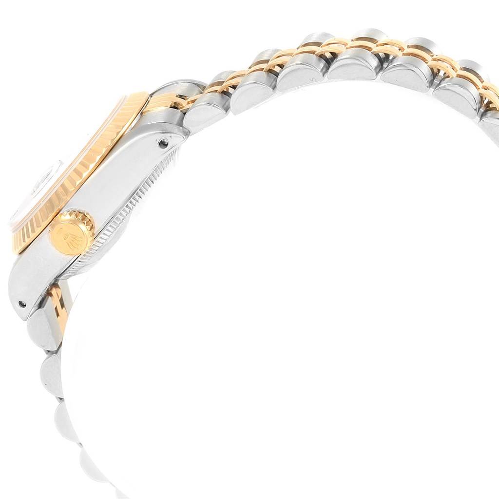 The image shows a side view of the Rolex Datejust 69173 Women's Stainless Steel Blue Dial 69173 Women's Stainless Steel Blue Dial watch, highlighting the bezel, crown, and part of the bracelet.