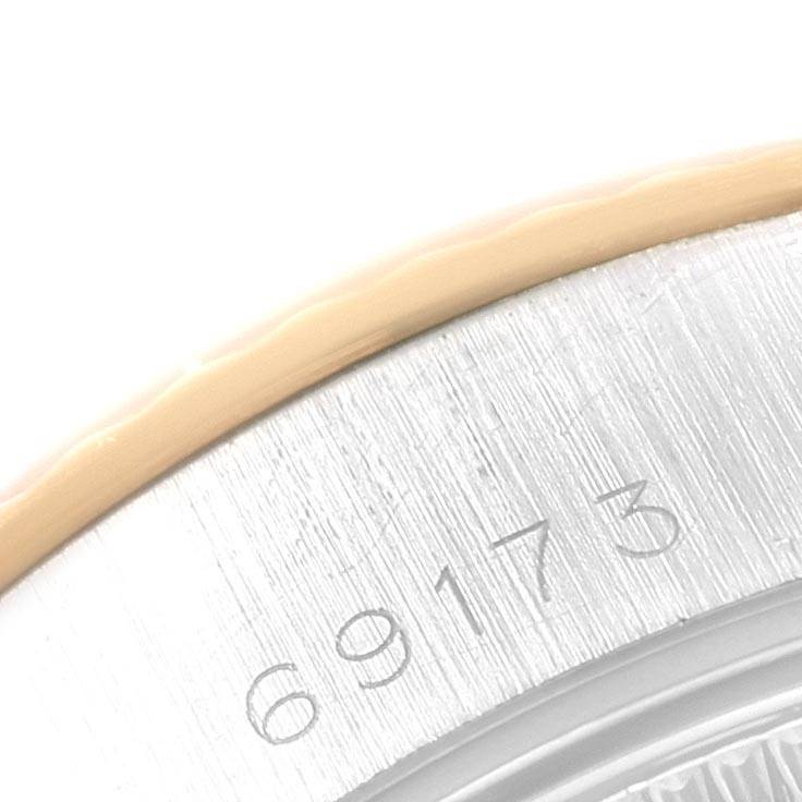 The image shows a close-up view of the case back and edge of the bezel of a Rolex Datejust 69173 Women's Stainless Steel Blue Dial 69173 Women's Stainless Steel Blue Dial watch, revealing part of the reference number "69173."