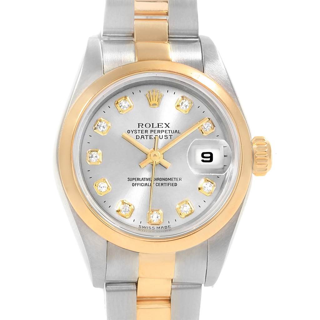 This is a front view of a Rolex Datejust 79163 Women's Steel and Gold (two tone) Silver Dial 79163 Women's Steel and Gold (two tone) Silver Dial, showing its dial, bezel, crown, and part of the bracelet.