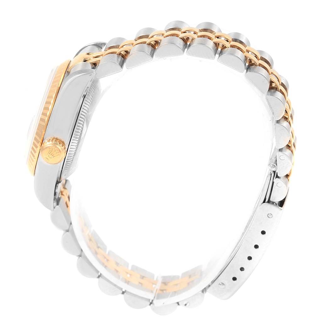 The image shows a side view of a Rolex Datejust 79173 Women's Steel and Gold (two tone) Beige Dial 79173 Women's Steel and Gold (two tone) Beige Dial watch, highlighting its crown, case, and two-tone Jubilee bracelet.