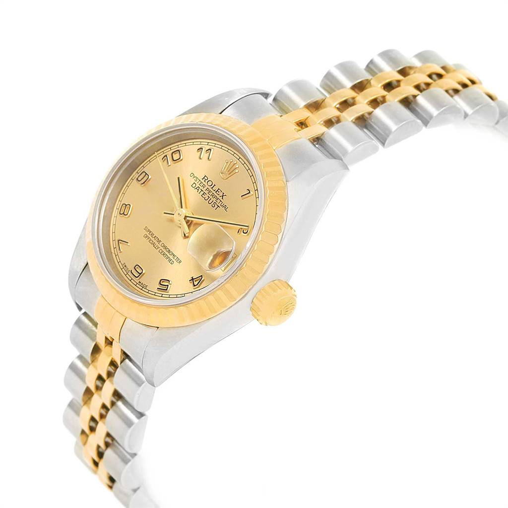 The image shows a side-angle view of a Rolex Datejust 79173 Women's Steel and Gold (two tone) Champagne Dial 79173 Women's Steel and Gold (two tone) Champagne Dial watch, highlighting the dial, crown, and two-tone bracelet.