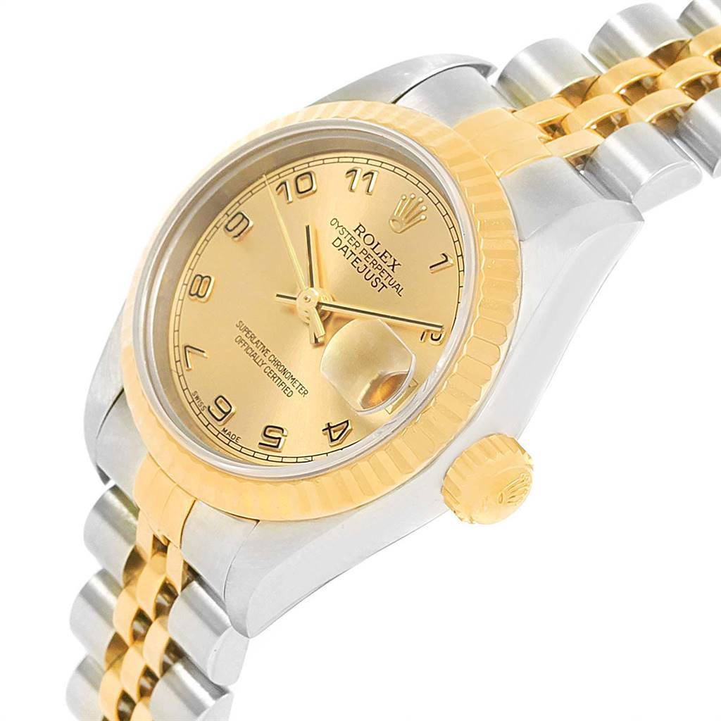 The image shows a Rolex Datejust 79173 Women's Steel and Gold (two tone) Champagne Dial 79173 Women's Steel and Gold (two tone) Champagne Dial watch at an angled view, highlighting the dial, fluted bezel, crown, and part of the two-tone bracelet.