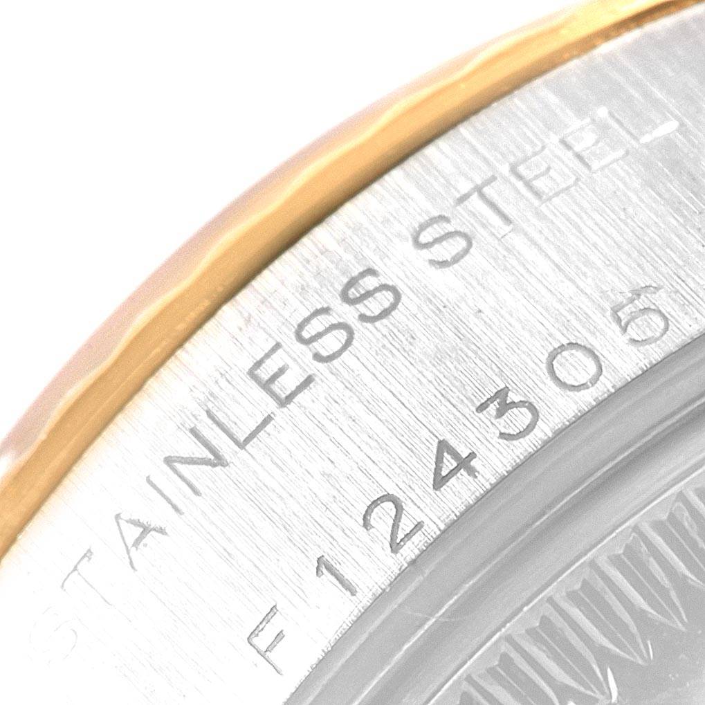 This image shows a close-up of the stainless steel caseback of a Rolex Datejust 79173 Women's Steel and Gold (two tone) Champagne Dial 79173 Women's Steel and Gold (two tone) Champagne Dial watch, featuring some engraved text.