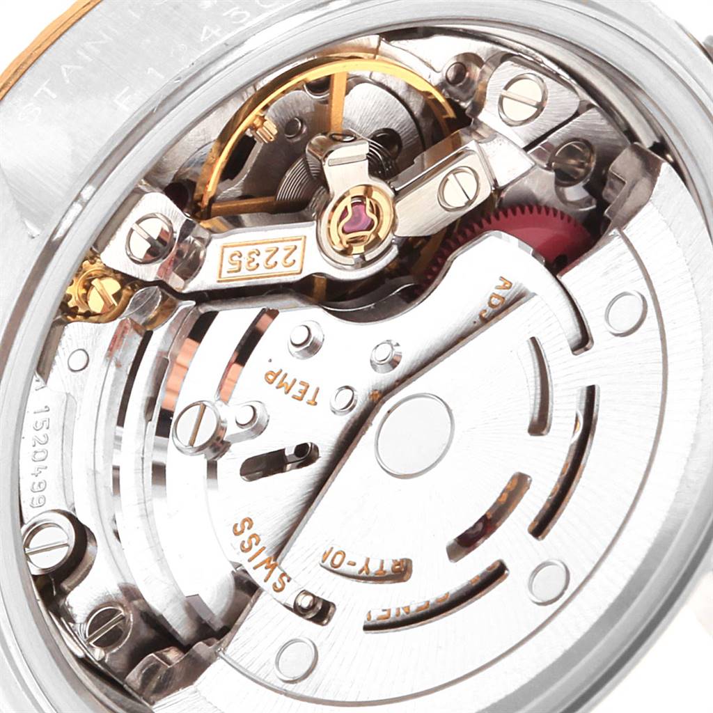 Close-up of the movement mechanism of a Rolex Datejust 79173 Women's Steel and Gold (two tone) Champagne Dial 79173 Women's Steel and Gold (two tone) Champagne Dial watch showing intricate gears and components.
