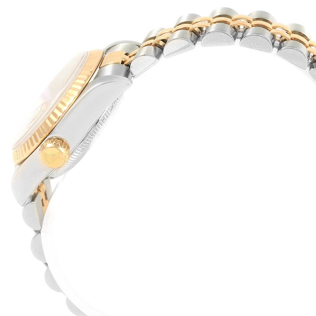 The image shows a side view of a Rolex Datejust 79173 Women's Steel and Gold (two tone) Champagne Dial 79173 Women's Steel and Gold (two tone) Champagne Dial, highlighting its two-tone bracelet and crown.