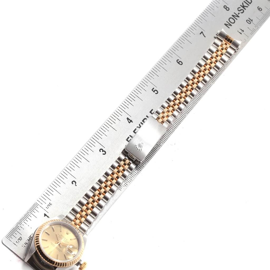 The image shows a Rolex Datejust 79173 Women's Steel and Gold (two tone) Champagne Dial 79173 Women's Steel and Gold (two tone) Champagne Dial watch face and band alongside a measuring ruler, displaying the length of the watch band.