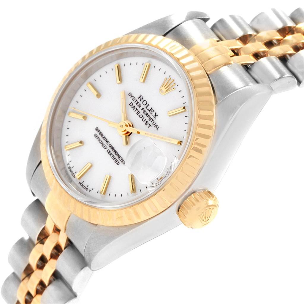The Rolex Datejust 69173 Women's Stainless Steel White Dial 69173 Women's Stainless Steel White Dial watch is shown at an angle displaying its white dial, gold fluted bezel, crown, and two-tone bracelet.