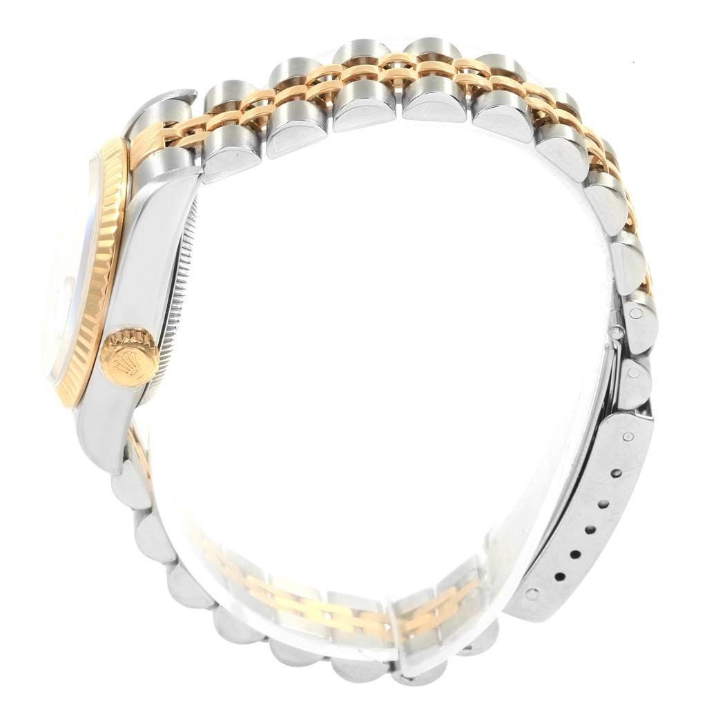 The image shows a side view of the Rolex Datejust 69173 Women's Stainless Steel White Dial 69173 Women's Stainless Steel White Dial watch, highlighting its two-tone bracelet and crown.