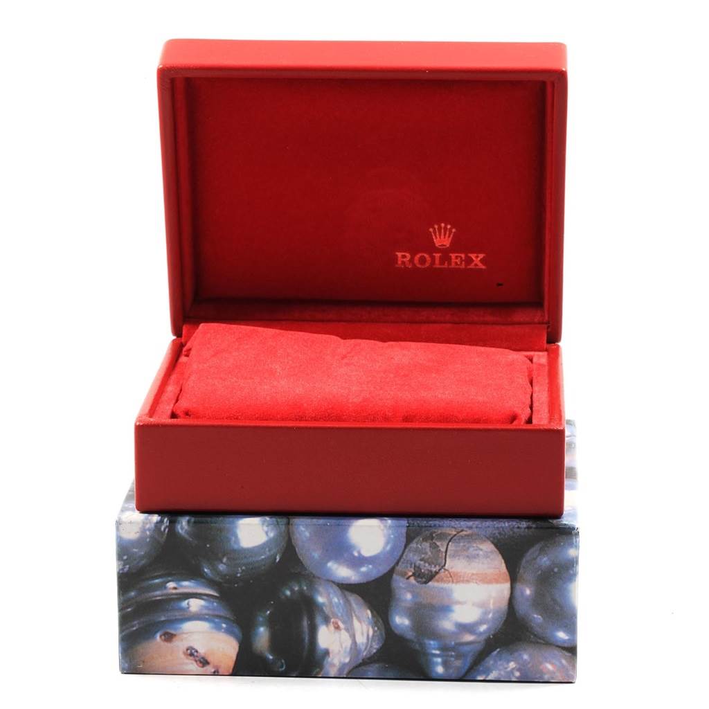 The image shows a red Rolex Datejust 69173 Women's Stainless Steel White Dial 69173 Women's Stainless Steel White Dial watch box, open to display the interior with a cushion for holding the watch.