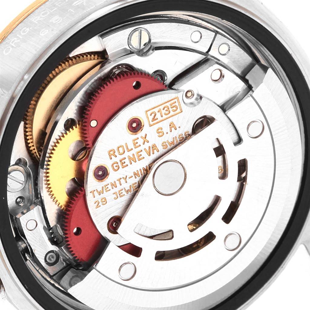 This image shows the internal movement mechanism of a Rolex Datejust 69173 Women's Stainless Steel White Dial 69173 Women's Stainless Steel White Dial watch, highlighting gears and the rotor.