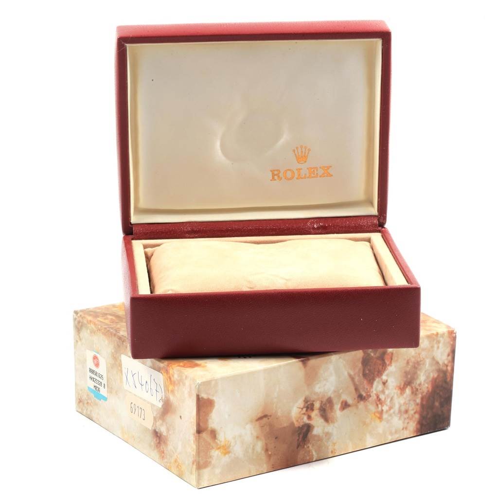 The image shows an open red and beige box for a Rolex Datejust 69173 Women's Stainless Steel Black Dial 69173 Women's Stainless Steel Black Dial watch, without the watch present.