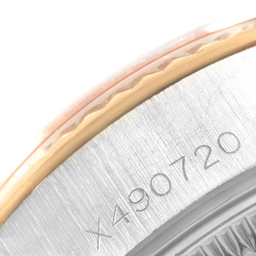 The image shows a close-up of the bezel and part of the casing with engravings of a Rolex Datejust 69173 Women's Stainless Steel Black Dial 69173 Women's Stainless Steel Black Dial model watch.