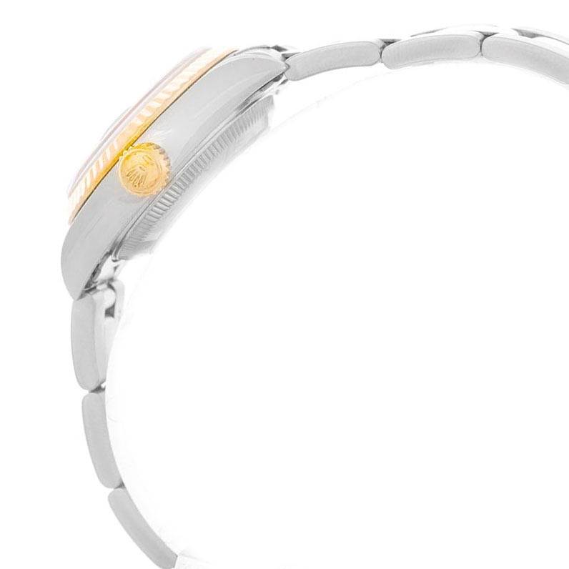 The image shows a side view of a Rolex Datejust 79173 Women
s Stainless Steel Black Dial 79173 Women
s Stainless Steel Black Dial model, highlighting the crown and part of the bracelet.