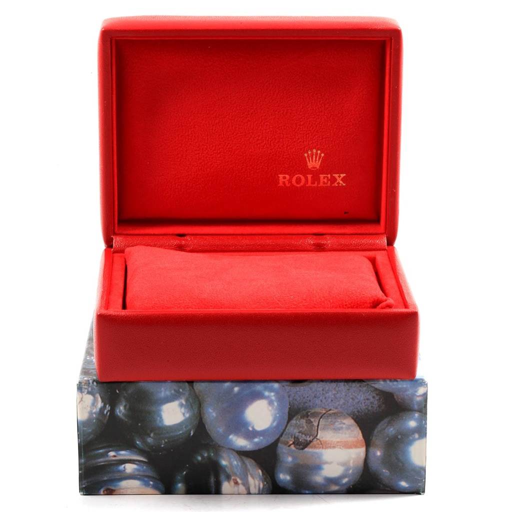 The image shows an open red watch box with the brand "Rolex" visible inside the lid, presumably for a Datejust model.