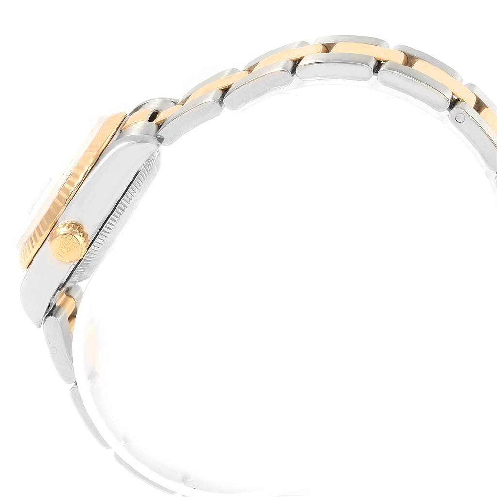 The image shows a side view of the Rolex Datejust 79173 Women's Steel and Gold (two tone) White Dial 79173 Women's Steel and Gold (two tone) White Dial watch, highlighting part of the bracelet and crown.