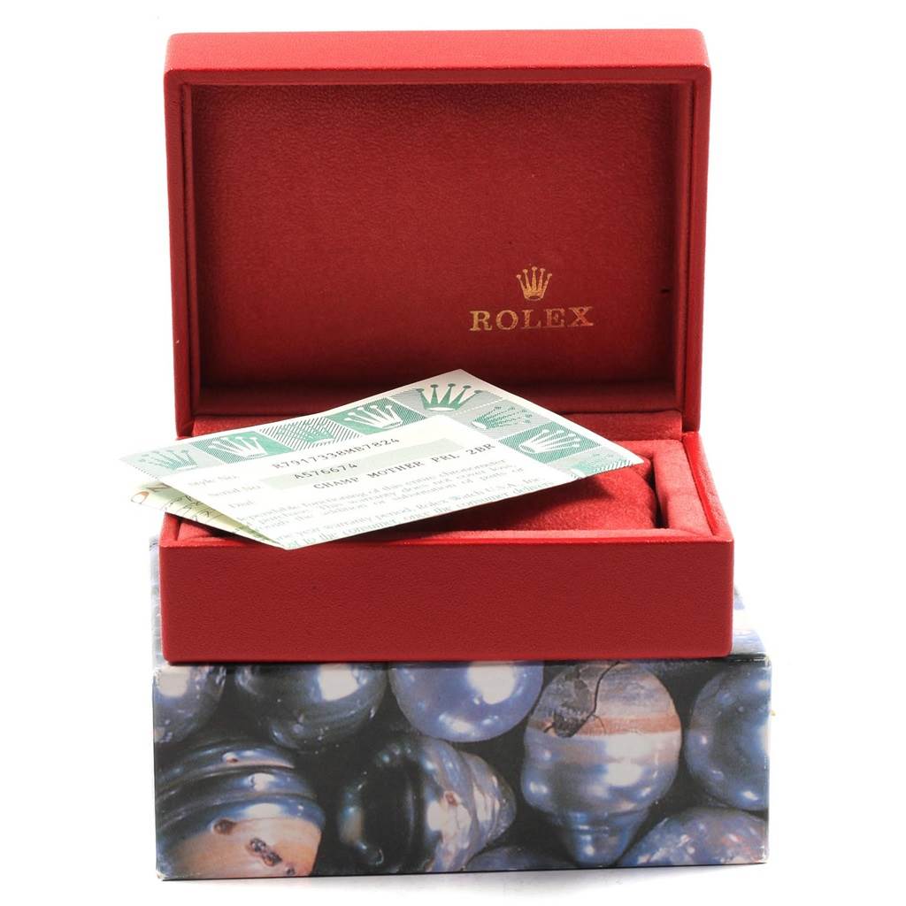 The image shows a red Rolex watch box and certificate card for a Rolex Datejust 79173 Women's Stainless Steel Mother of Pearl Dial 79173 Women's Stainless Steel Mother of Pearl Dial model, with the lid open.