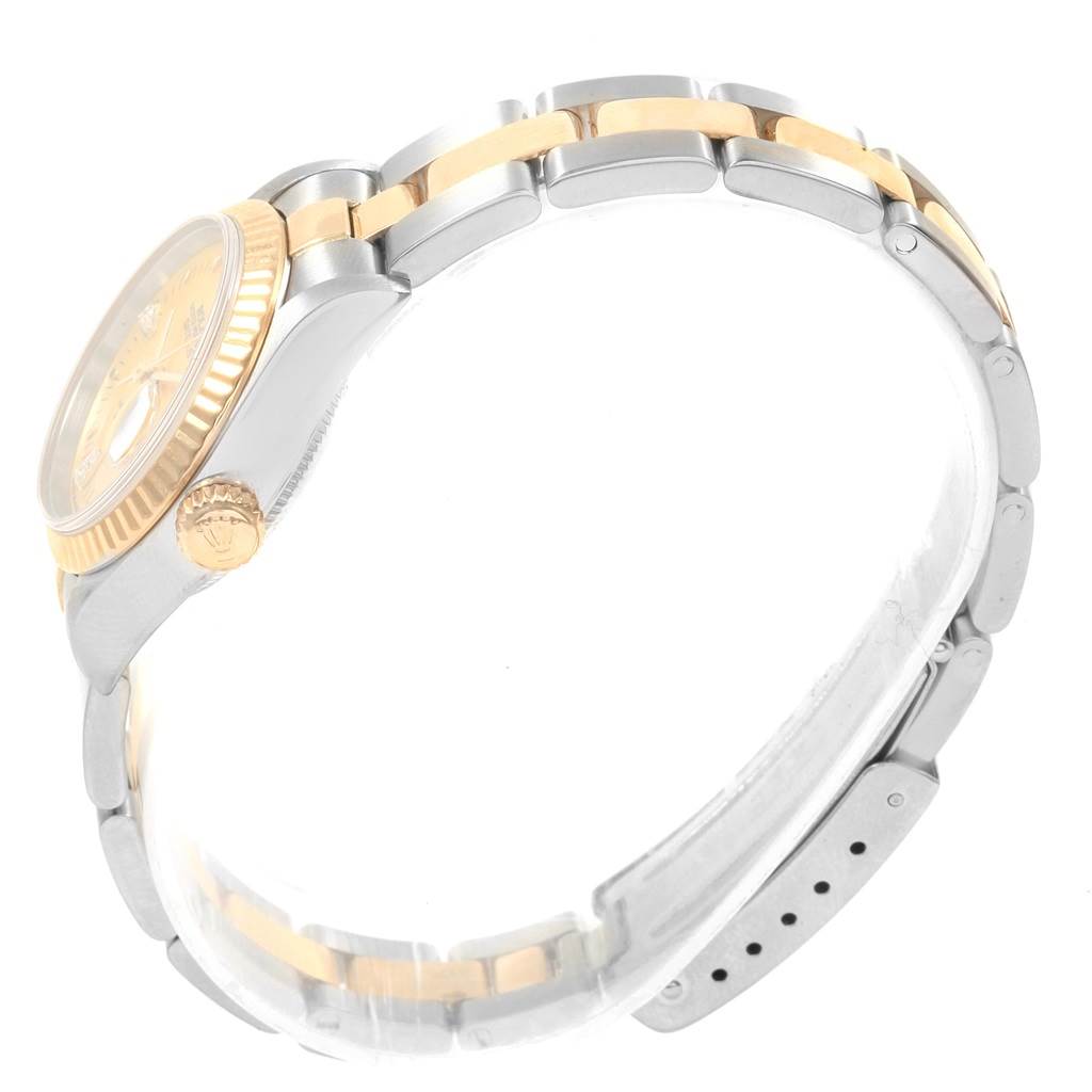 The image shows a side view of the Rolex Datejust 79173 Women's Stainless Steel Mother of Pearl Dial 79173 Women's Stainless Steel Mother of Pearl Dial watch, highlighting its two-tone band and fluted bezel.
