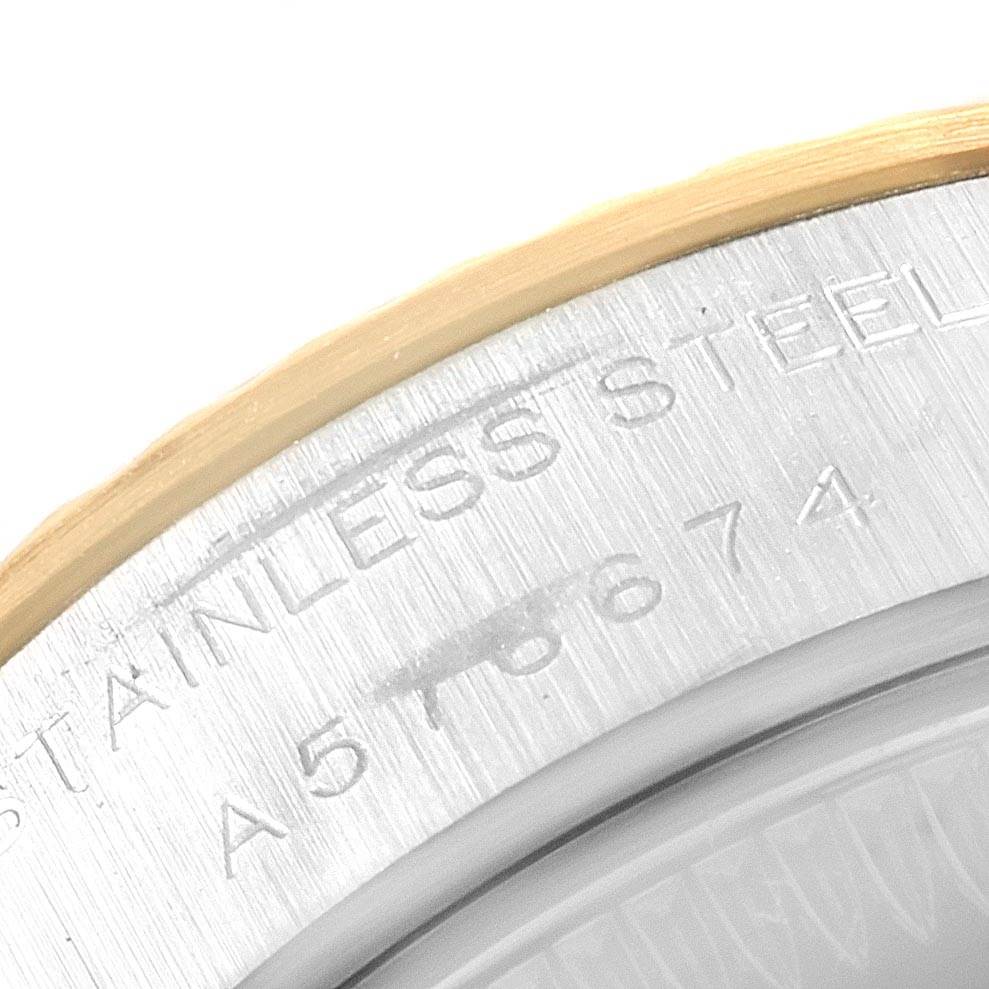 This is a close-up of the bezel and serial number engraving on a Rolex Datejust 79173 Women's Stainless Steel Mother of Pearl Dial 79173 Women's Stainless Steel Mother of Pearl Dial watch.