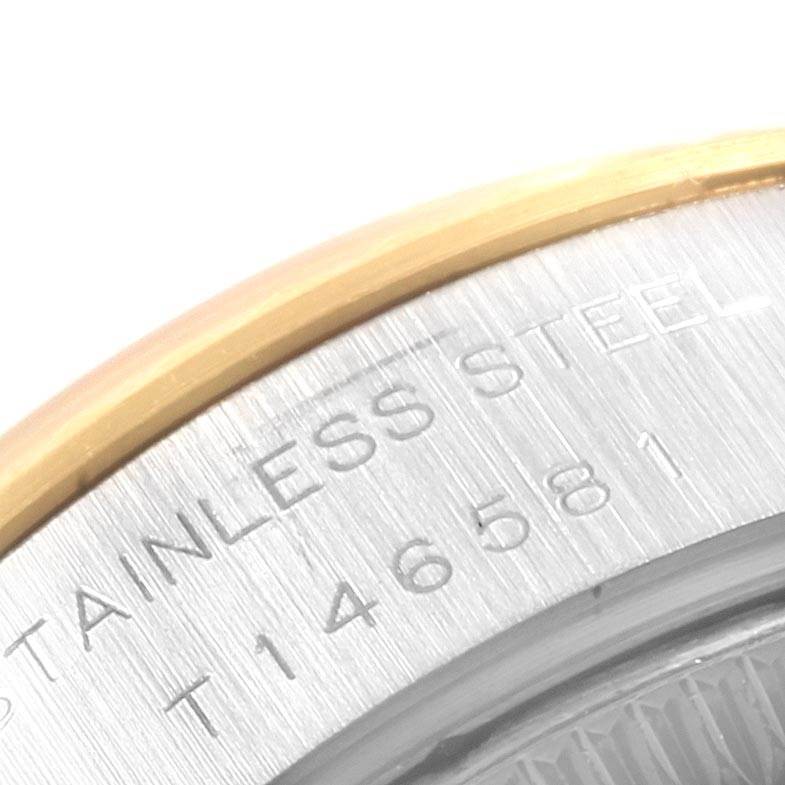 This image shows a close-up of the caseback edge of a Rolex Datejust 69173 Women's Stainless Steel Beige Dial 69173 Women's Stainless Steel Beige Dial watch, highlighting the stainless steel material marking.
