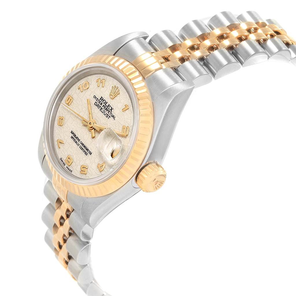 The image shows a Rolex Datejust 69173 Women's Stainless Steel Beige Dial 69173 Women's Stainless Steel Beige Dial watch from an angle highlighting its face, bezel, crown, and part of the bracelet.