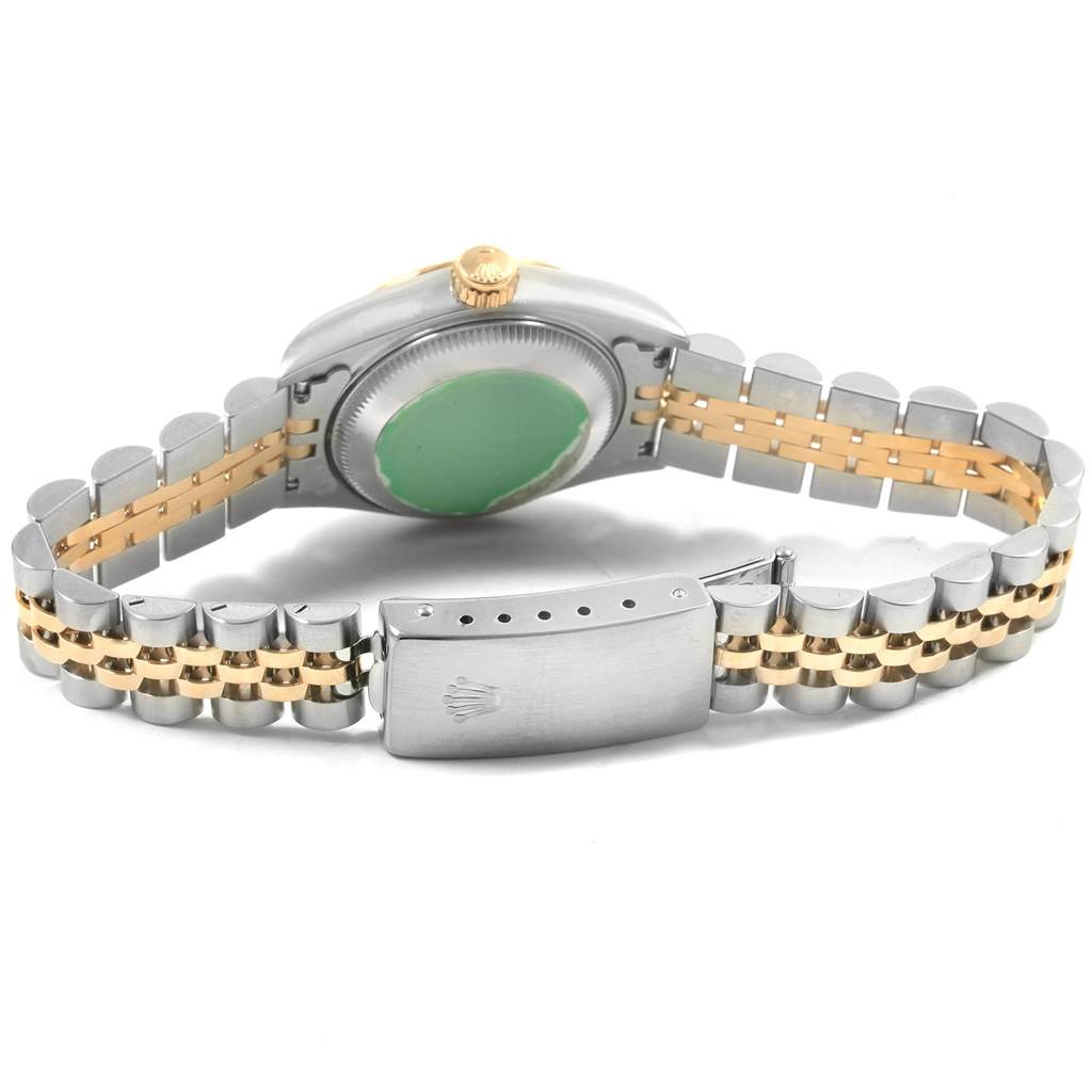 The image shows a Rolex Datejust 69173 Women's Stainless Steel Beige Dial 69173 Women's Stainless Steel Beige Dial watch from the back, highlighting its case, crown, and Jubilee bracelet.