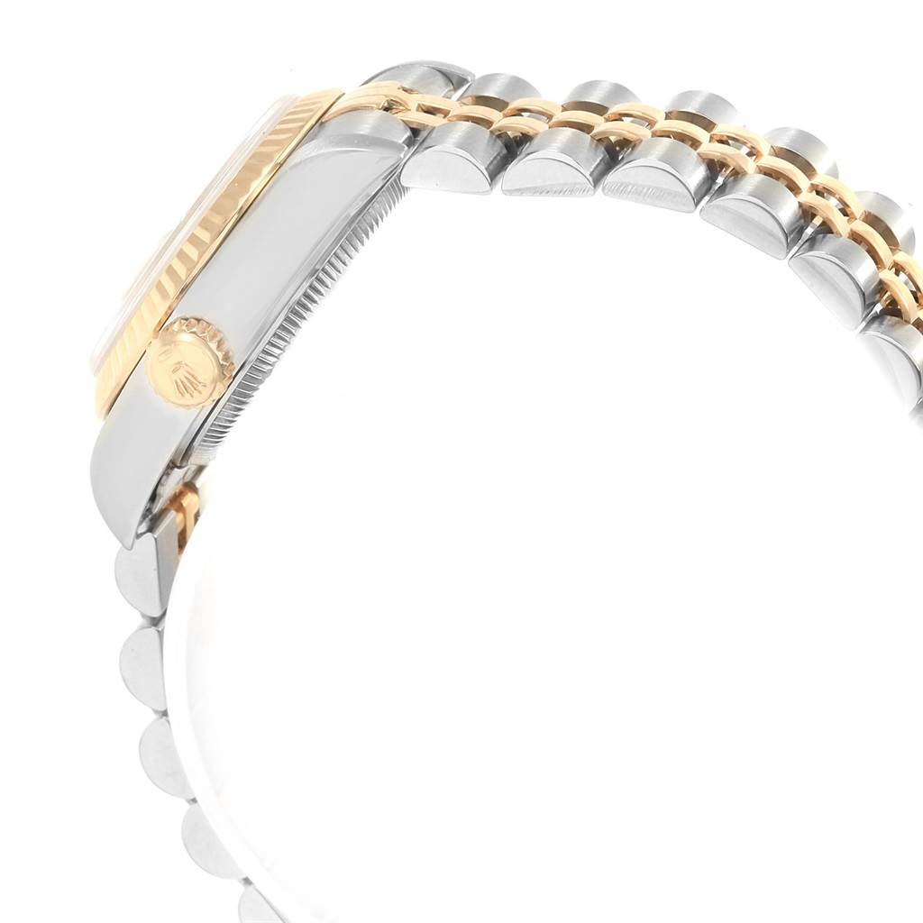 The image shows a side view of a Rolex Datejust 69173 Women's Stainless Steel Beige Dial 69173 Women's Stainless Steel Beige Dial watch featuring its fluted bezel, crown, and two-tone bracelet.