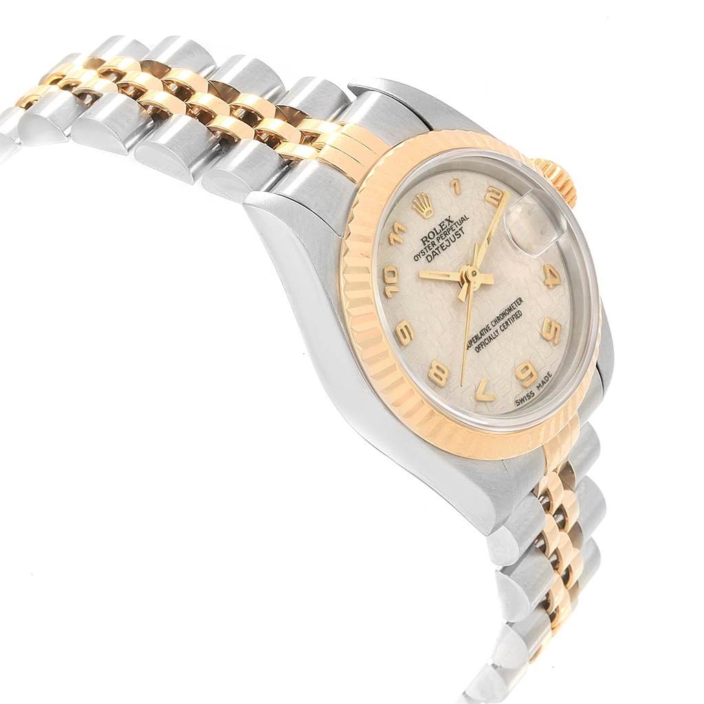 This image shows a side angle view of a Rolex Datejust 69173 Women's Stainless Steel Beige Dial 69173 Women's Stainless Steel Beige Dial watch, highlighting the bracelet, bezel, and dial.