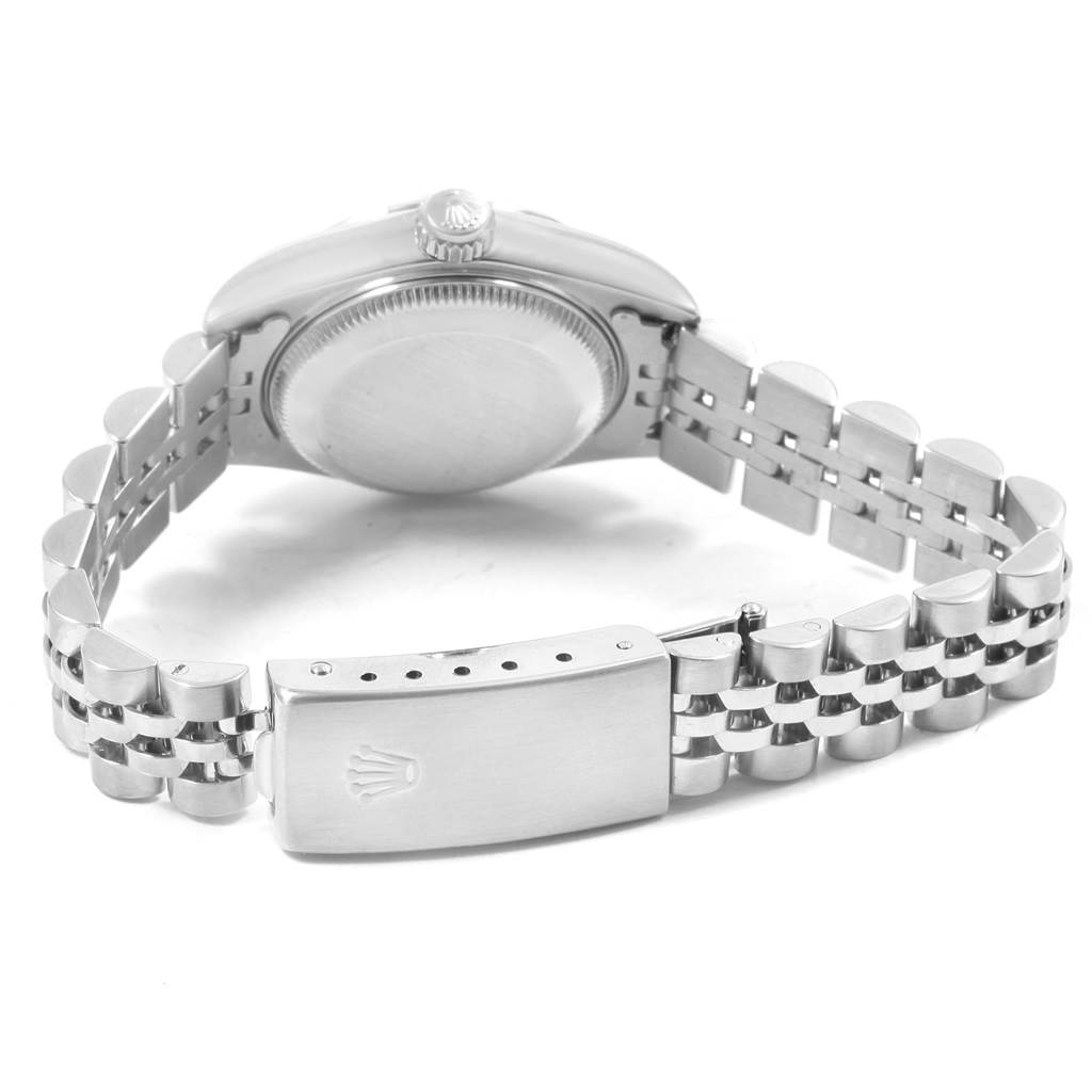 The image shows the back case and bracelet of a Rolex Datejust 79190 Women
s Stainless Steel White Dial 79190 Women
s Stainless Steel White Dial watch, displayed at an angle revealing the clasp.