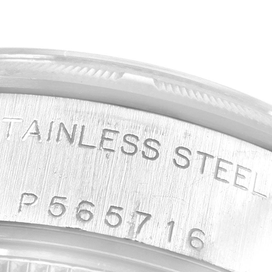 This image shows a close-up of an engraving on the stainless steel case of a Rolex Datejust 79190 Women
s Stainless Steel White Dial 79190 Women
s Stainless Steel White Dial watch.