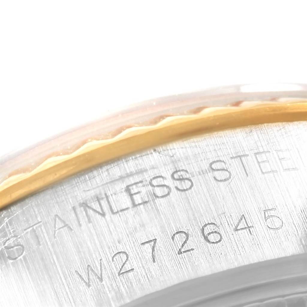 This close-up image shows the serial number and part of the bezel of a Rolex Datejust 69173 Women's Stainless Steel White Dial 69173 Women's Stainless Steel White Dial watch.
