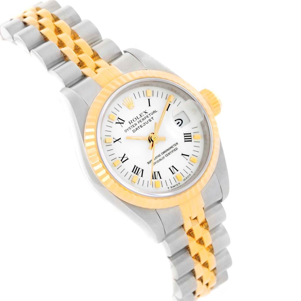 The image shows a Rolex Datejust 69173 Women's Stainless Steel White Dial 69173 Women's Stainless Steel White Dial watch with a two-tone bracelet, white dial, gold Roman numerals, and date window at an oblique angle.