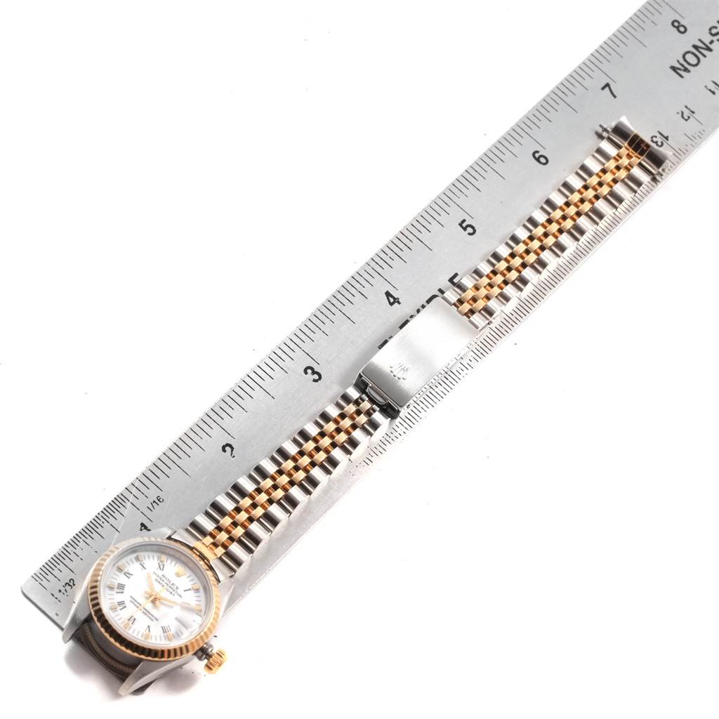 The image shows a Rolex Datejust 69173 Women's Stainless Steel White Dial 69173 Women's Stainless Steel White Dial watch laid flat with a steel ruler measuring the length of its two-tone bracelet.