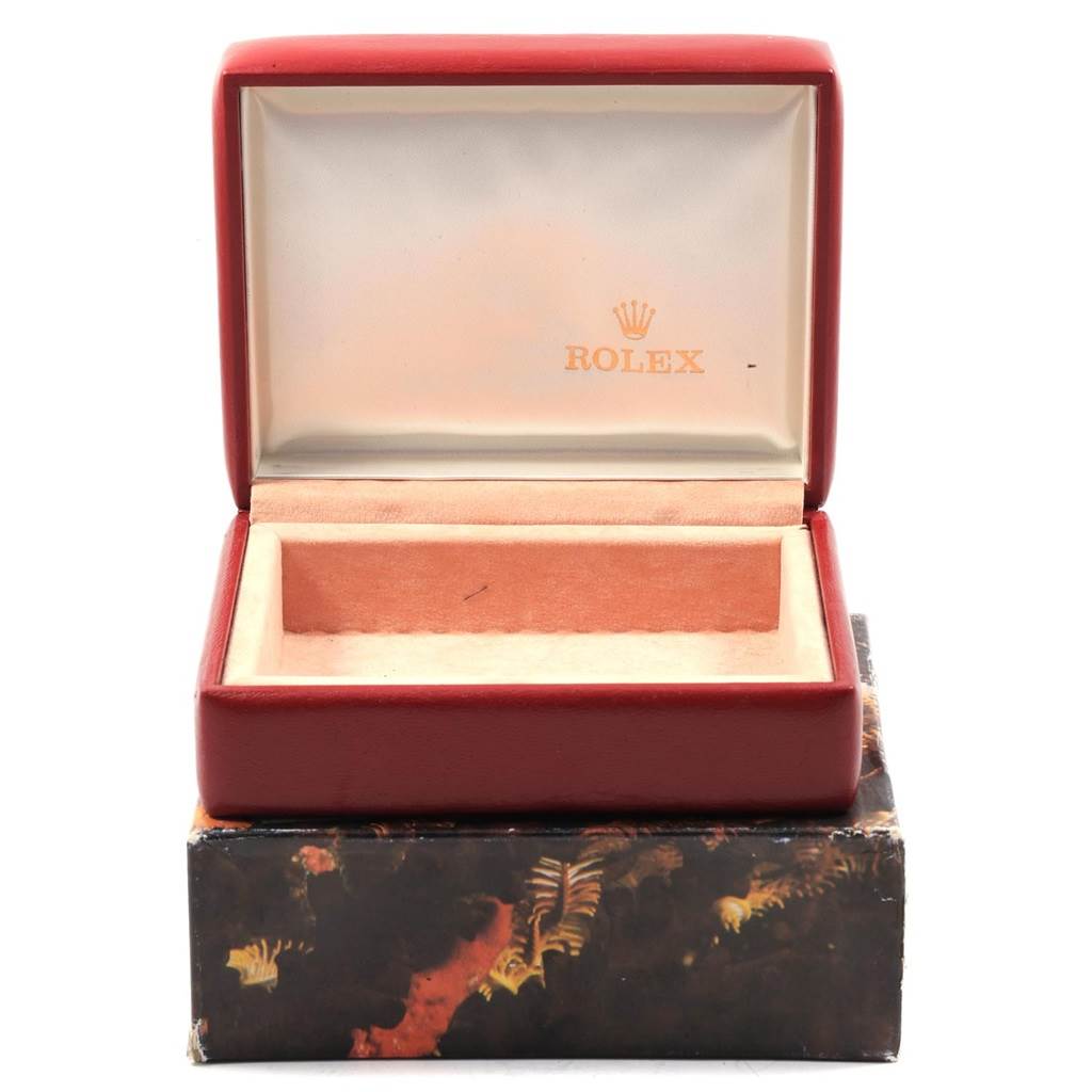 This image shows an open Rolex Datejust 69173 Women's Stainless Steel White Dial 69173 Women's Stainless Steel White Dial watch box without the watch, displaying the interior with the Rolex logo.