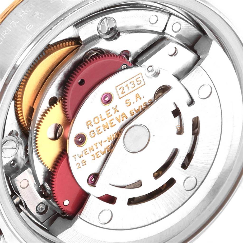 The image shows the movement mechanism of a Rolex Datejust 69173 Women's Stainless Steel Champagne Dial 69173 Women's Stainless Steel Champagne Dial watch, specifically the inner gears and components.