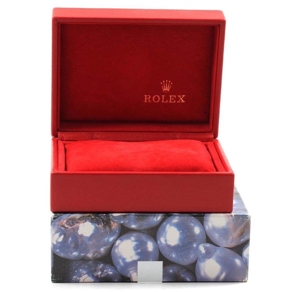 This image shows an open Rolex box in red, likely for the Datejust model, highlighting its interior and branding.