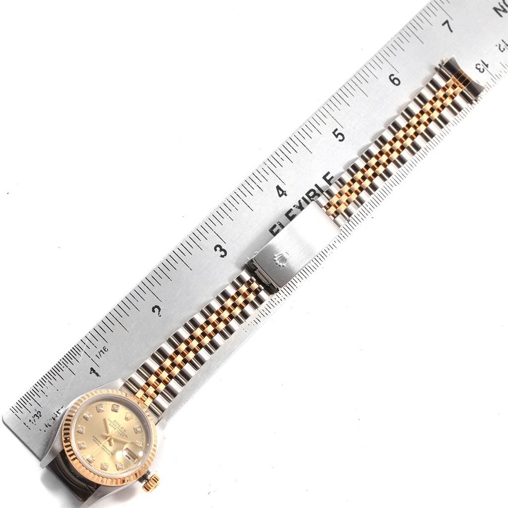 The image shows a top-down view of a Rolex Datejust 69173 Women's Stainless Steel Champagne Dial 69173 Women's Stainless Steel Champagne Dial watch placed along a ruler, focusing on the face, bezel, and bracelet.