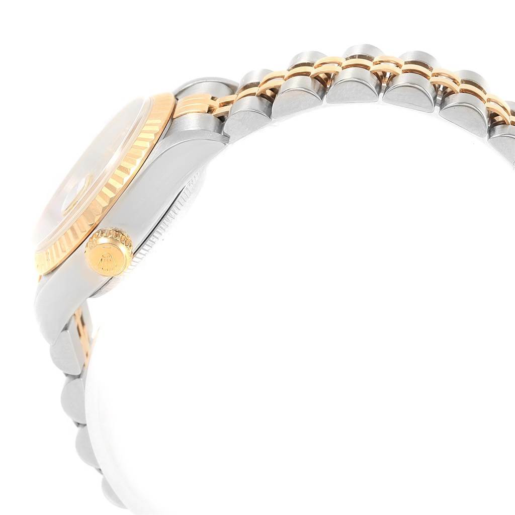 The image shows a side angle of a Rolex Datejust 69173 Women's Stainless Steel Champagne Dial 69173 Women's Stainless Steel Champagne Dial watch, highlighting the crown, case, and part of the bracelet.