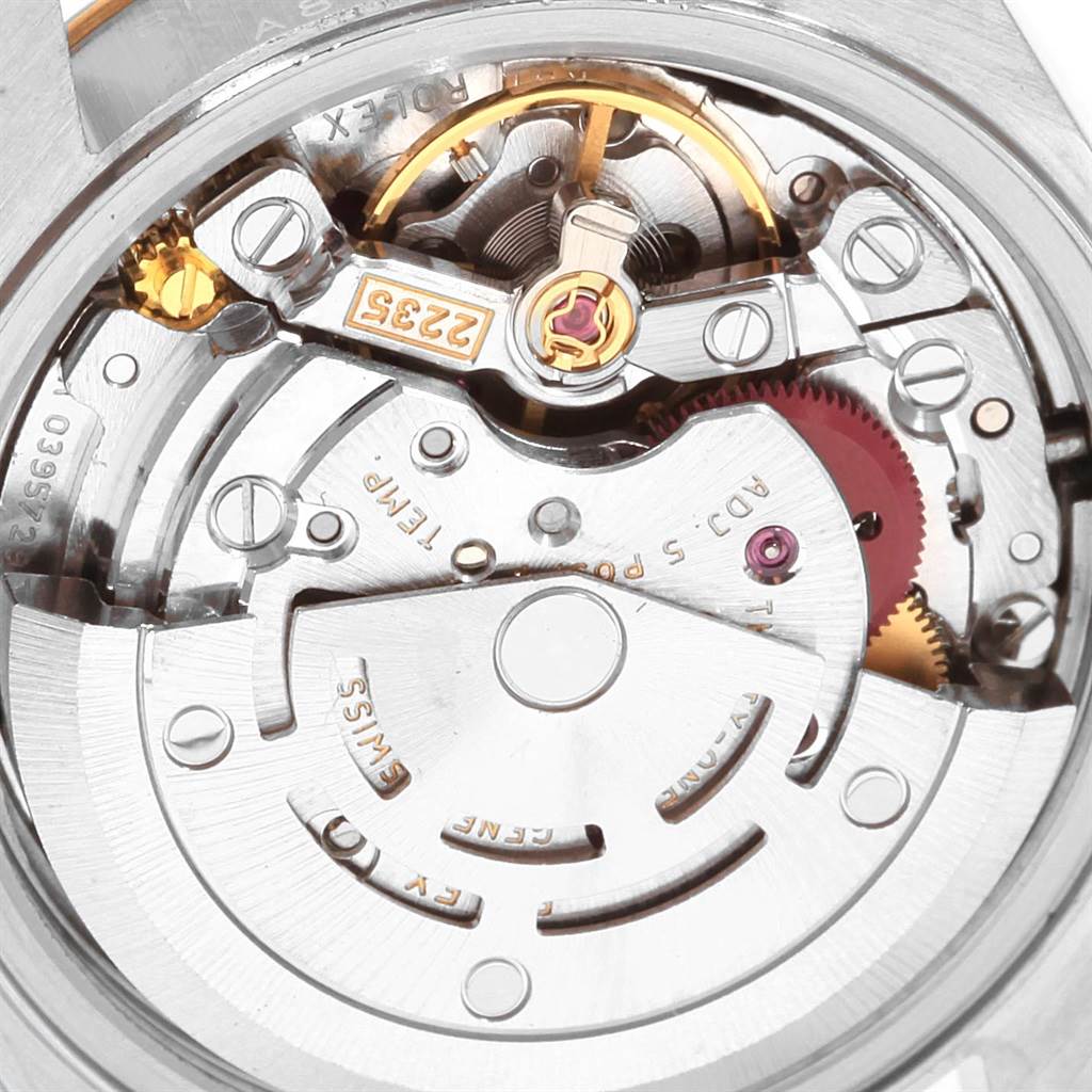 This image displays the movement mechanism of a Rolex Datejust 79173 Women's Steel and Gold (two tone) Beige Dial 79173 Women's Steel and Gold (two tone) Beige Dial, showcasing its intricate inner components from a close-up angle.