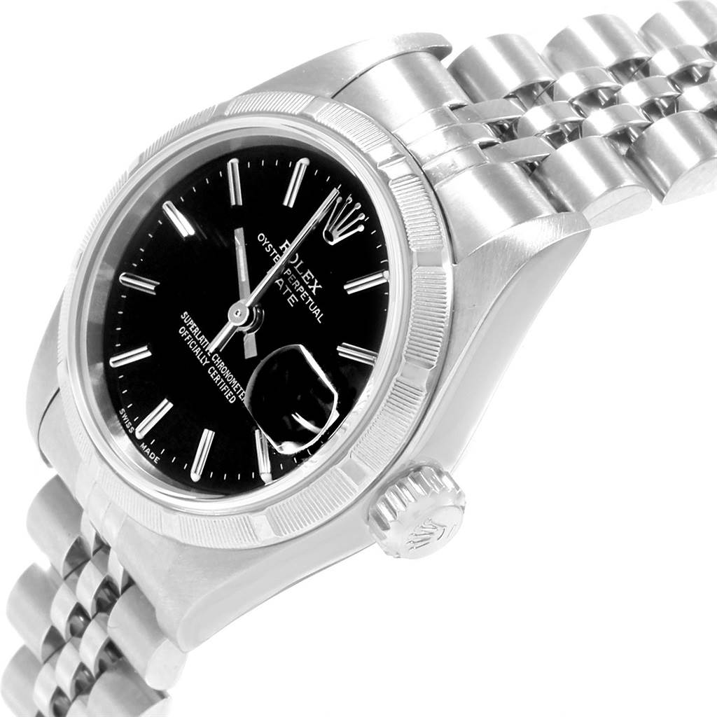 This image shows a side angle of a Rolex Datejust 79190 Women's Stainless Steel Black Dial 79190 Women's Stainless Steel Black Dial watch, highlighting the crown, bezel, and part of the bracelet.