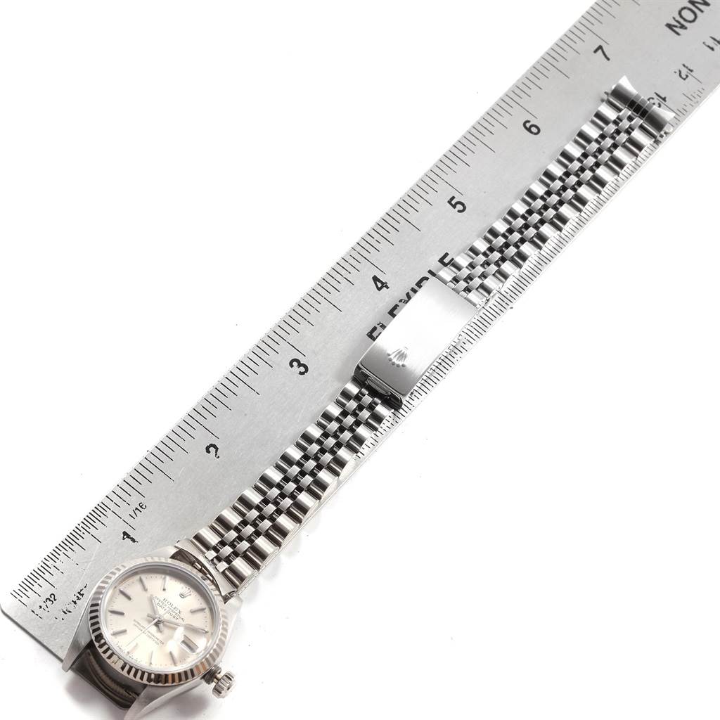 The image shows a Rolex Datejust 69174 Women's Stainless Steel Silver Dial 69174 Women's Stainless Steel Silver Dial watch laid flat with its bracelet and clasp next to a ruler for measurement.