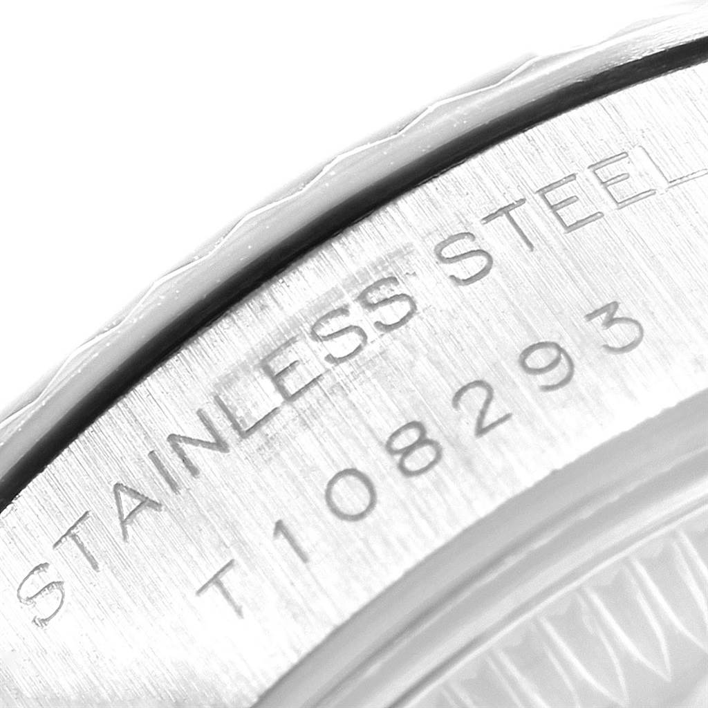 The image shows a close-up angle of the side engraving on the stainless steel casing of a Rolex Datejust 69174 Women's Stainless Steel Silver Dial 69174 Women's Stainless Steel Silver Dial watch.