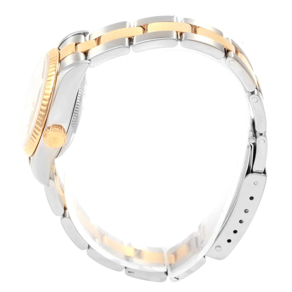The image shows a side view of a Rolex Datejust 79173 Women's Steel and Gold (two tone) Beige Dial 79173 Women's Steel and Gold (two tone) Beige Dial watch, highlighting the two-tone bracelet and the fluted bezel.