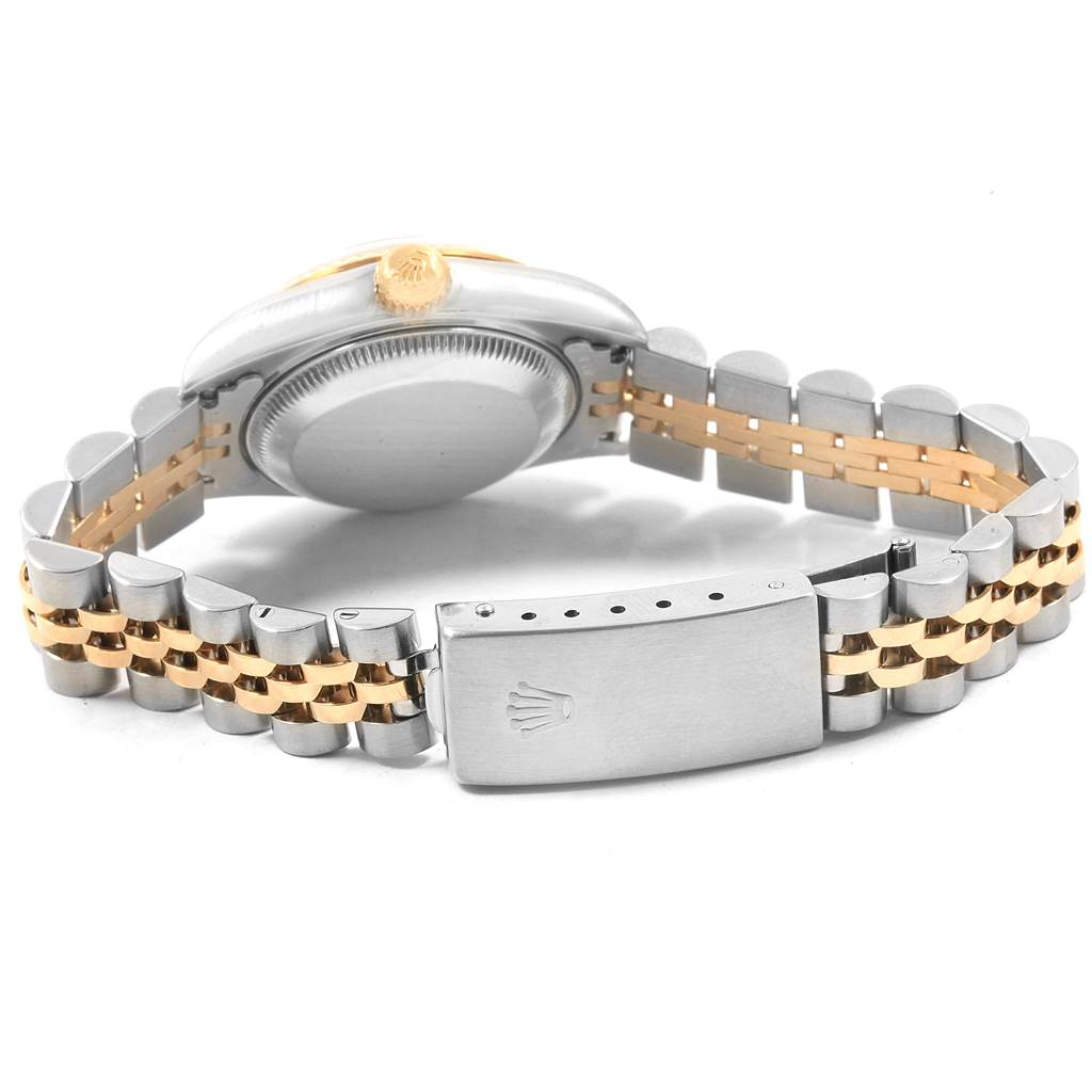 This Rolex Datejust 69173 Women's Stainless Steel Grey Dial 69173 Women's Stainless Steel Grey Dial watch is shown from the side, highlighting the case back and the two-tone bracelet with a clasp.